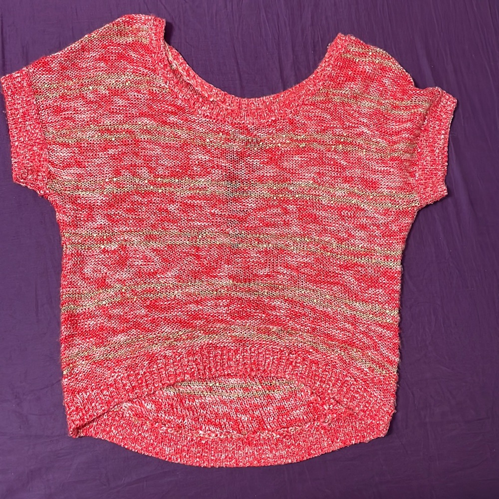 Large short sleeved sweater with a styled open back